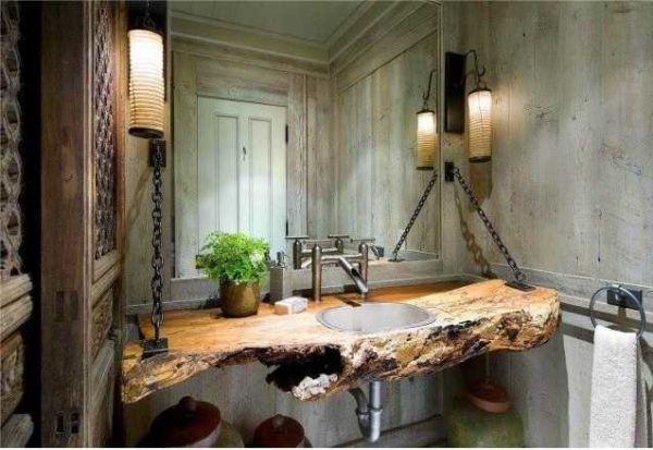 Esta casa de banho tem um estilo na junção do loft com o eco