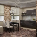 En la foto, la división del área de la cocina y la sala de estar usando diferentes texturas del piso.