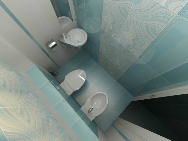 Une autre option pour l'emplacement de la plomberie est le long du long mur des toilettes et du bidet, le lavabo est dans le coin