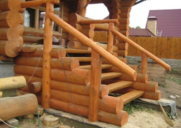 Log porch to a log house