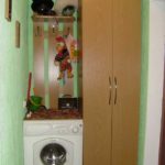In the photo - the option of installing a washing machine in a narrow corridor