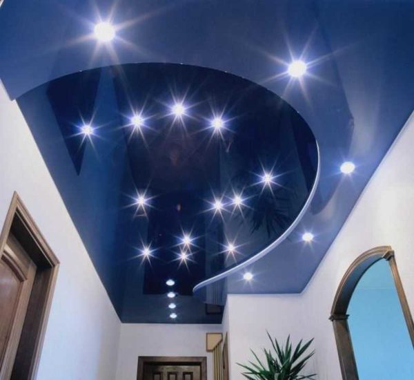 The best option is LED bulbs. They do not heat up and the light does not enter the ceiling space