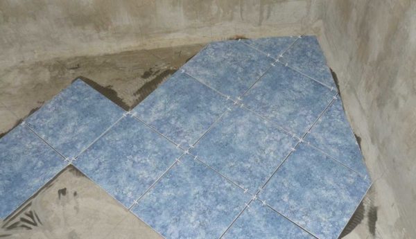 Laying tiles on the floor